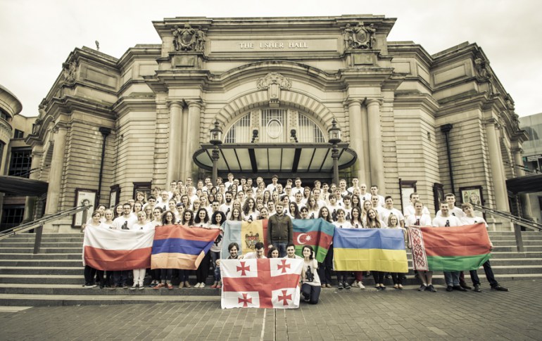Members of the I, CULTURE Orchestra with flags outside Usher Hall, Edinburgh, 2014, photo: © Konrad Ćwik / Culture.pl