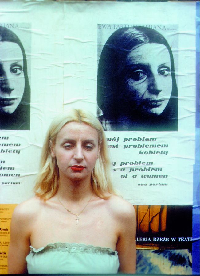 Ewa Partum in front of the posters My Problem is a Problem of a Woman / Mój problem jest problemem kobiety, Warsaw, 1978, photo courtesy of Zachęta - National Gallery of Art